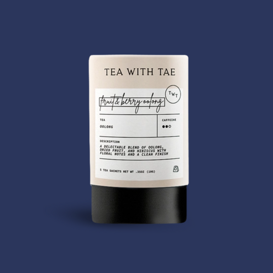 Tea package with label; TEA WITH TAE, Fruit & Berry flavor; on a blue background