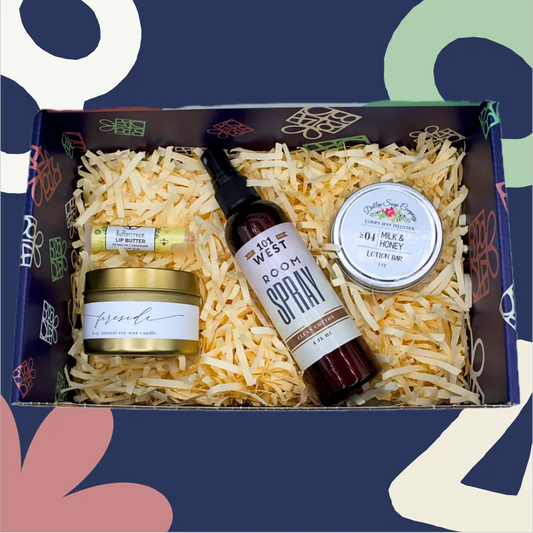 Gift set with lip butter, spray, and honey in a decorative box on a colorful background