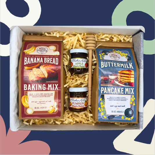 Baking mix and pancake mix set with apple butter in a box on a colorful background