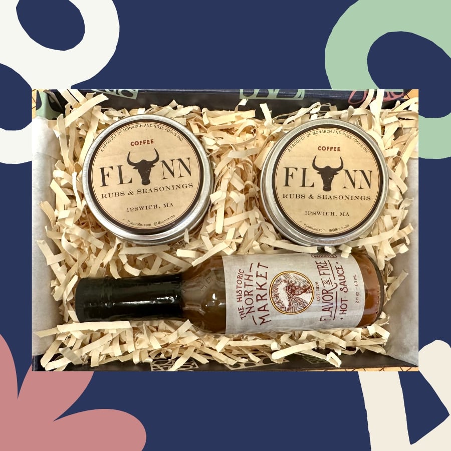 Box with two jars labeled 'Flann' and a bottle of 'Flavor Market' sauce on a decorative background.