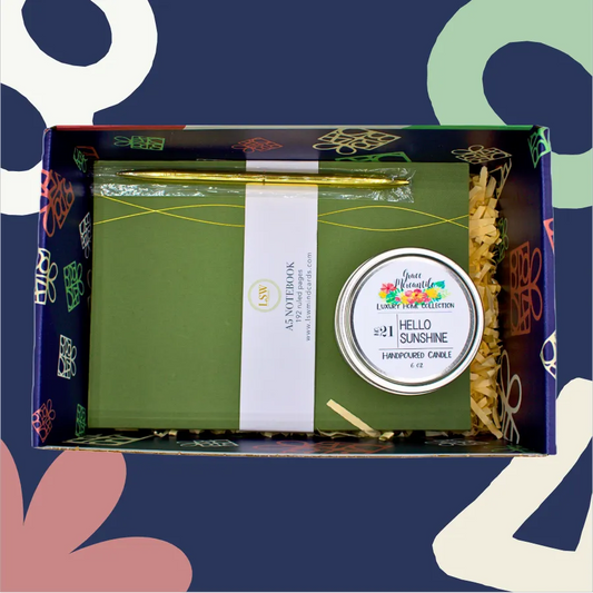 Candle in a decorative box with a colorful label on a blue background