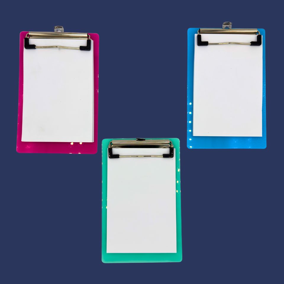 Three clipboards with colorful frames on a dark blue background
