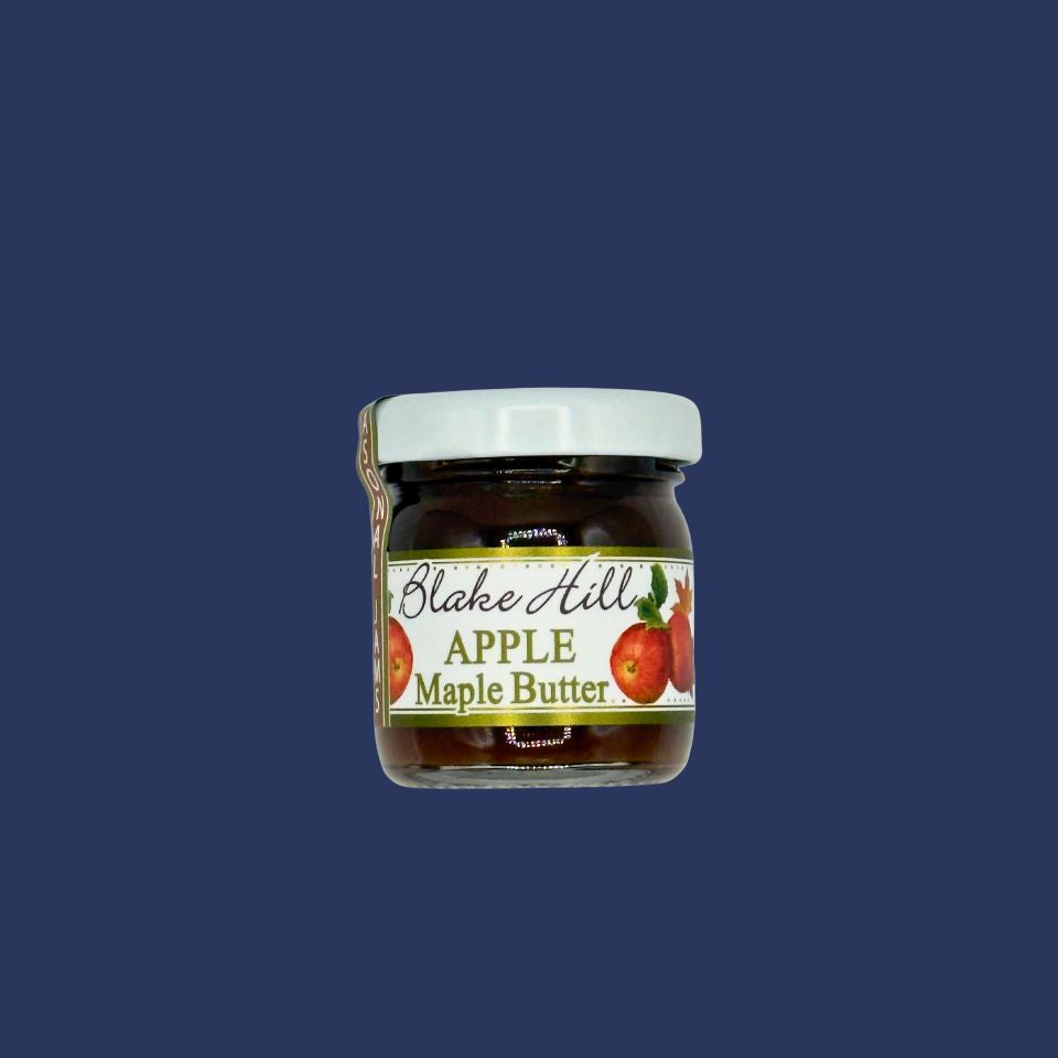 Jar of Blake Hill Apple Maple Butter jam on a blue background