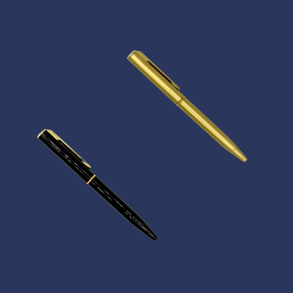 Gold and black pens on a blue background