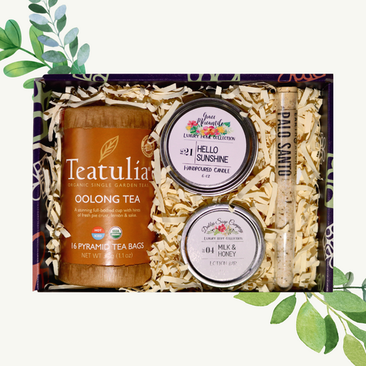 A gift set containing Teatulia Oolong Tea, a jar of honey, and a tube of lip balm, all presented in a box with a 'Hello Sunshine' lip balm label.