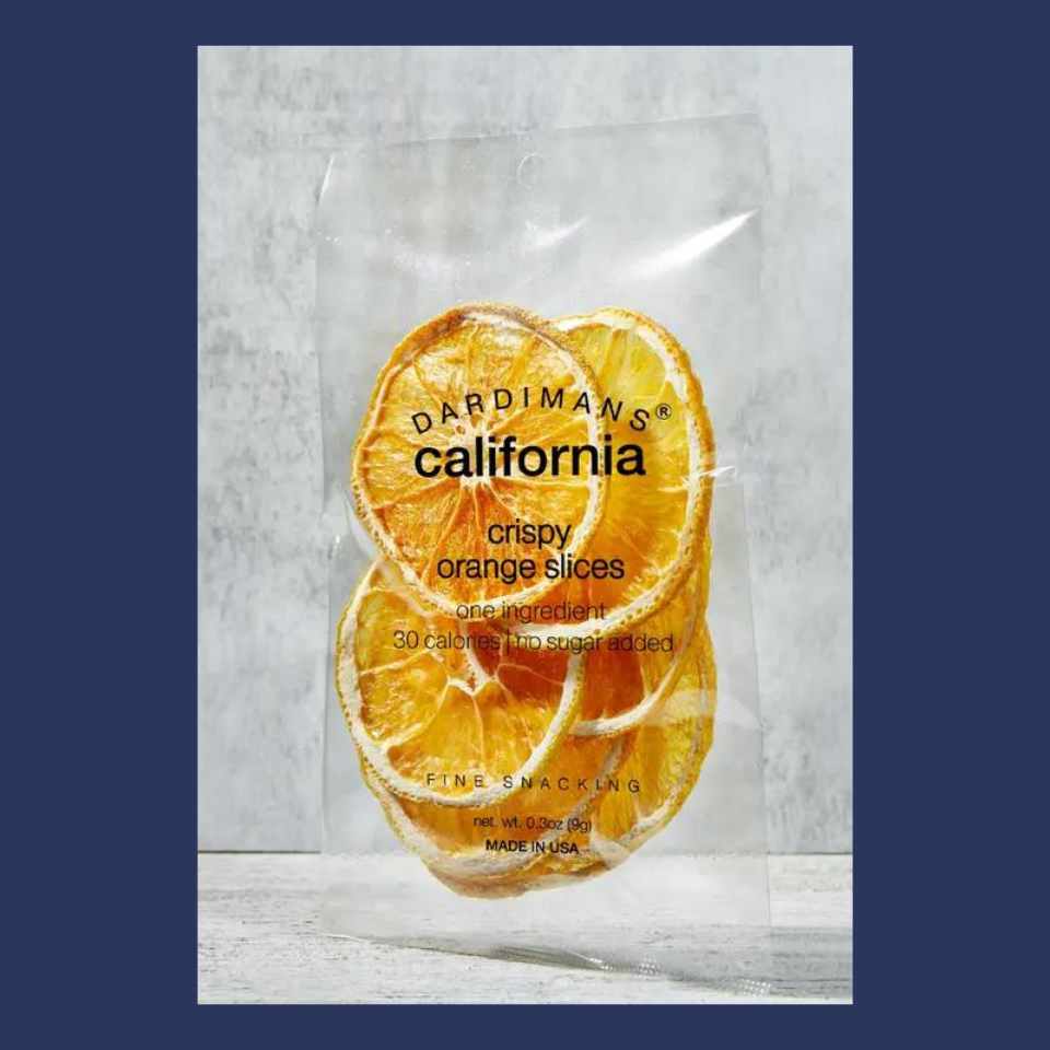 crispy oranges placed in a plastic package; centrally placed on a navy background